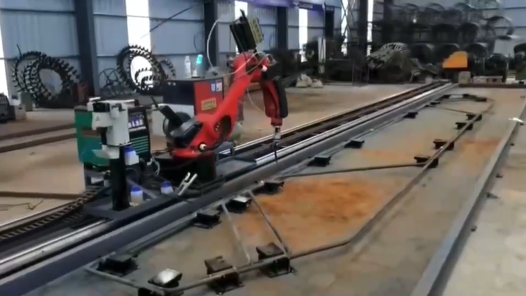 industrial robot with moving guide rail for welding application